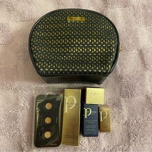 Cle de Peau Black and Gold Cosmetic Bag with Products